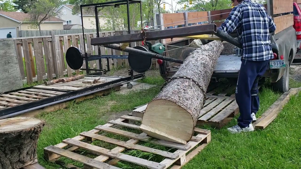 log arch trailer loading and unloading with roller system
