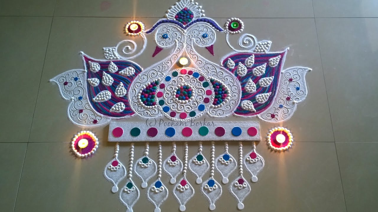 Beautiful and unique twin peacock rangoli by Poonam Borkar | Innovative rangoli designs