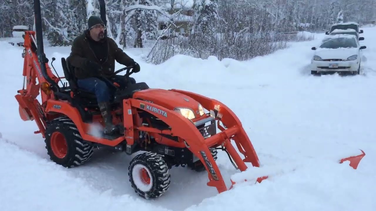 Kubota Tractor BX25D Plowing Snow