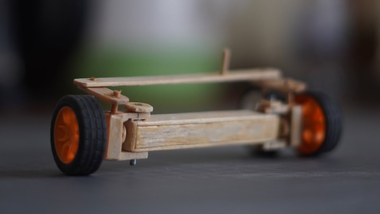 Making a front suspension with steering for car from ice cream sticks