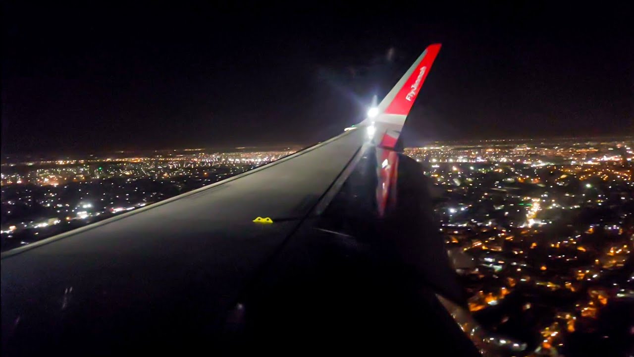 Airplane landing at night in Lahore - Allama Iqbal International Airport - Airbus A320