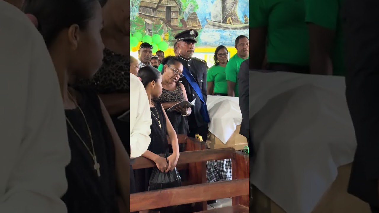 Native Indians in Kalinago Territory bury their dead in a Charamatic Catholic service in Dominica.