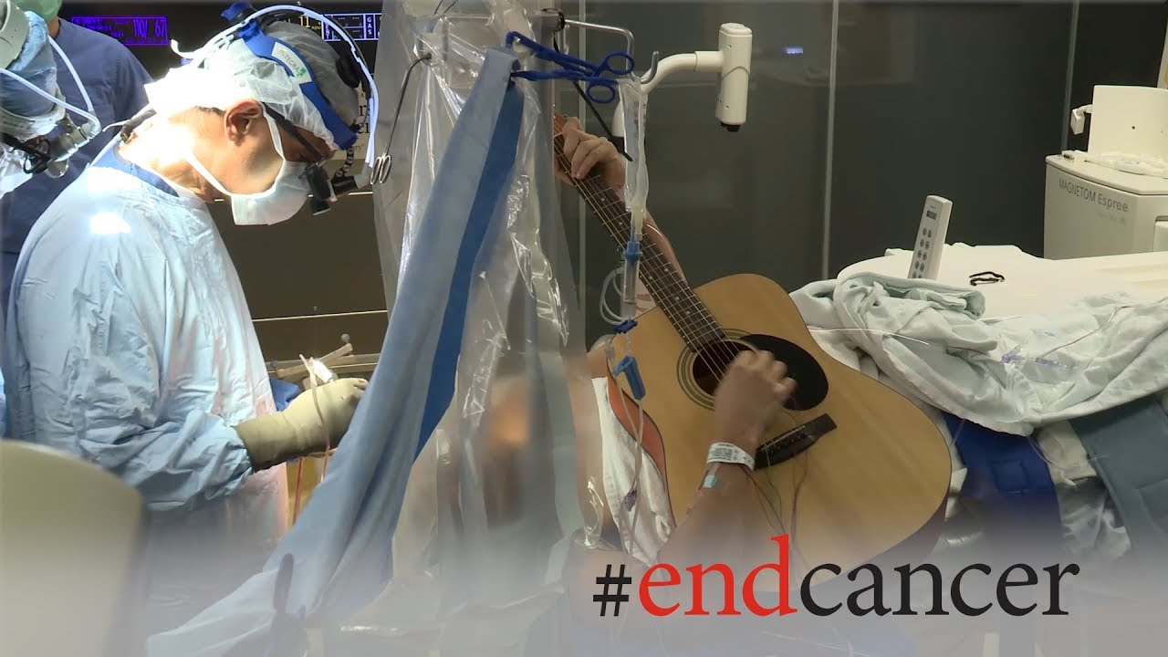 Brain tumor patient plays guitar during awake craniotomy surgery