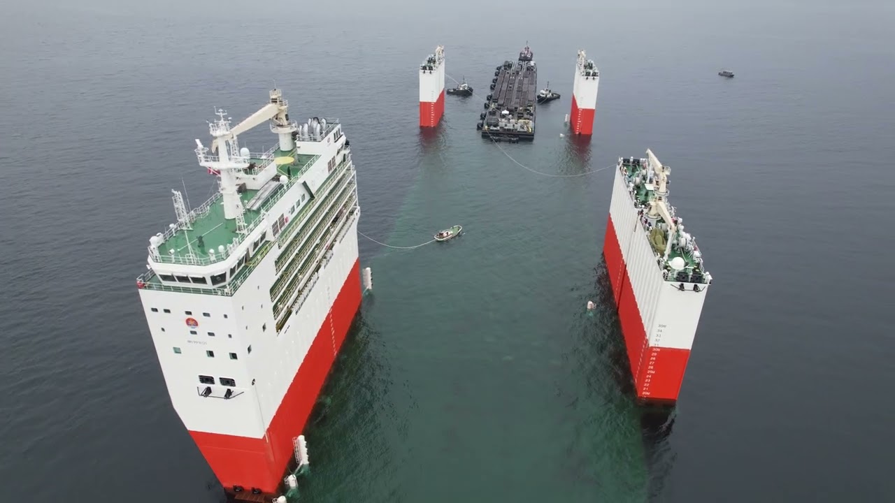 Massive semi-submersible ship Hua Rui Long loading a ship dock in Victoria