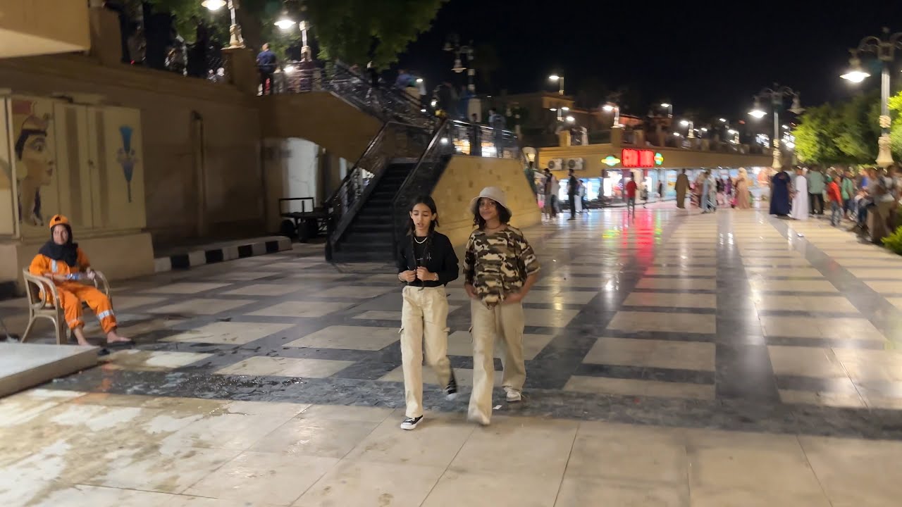 Night walk in Luxor downtown along the busy Nile River promenade Corniche al Nil | Egypt 2023