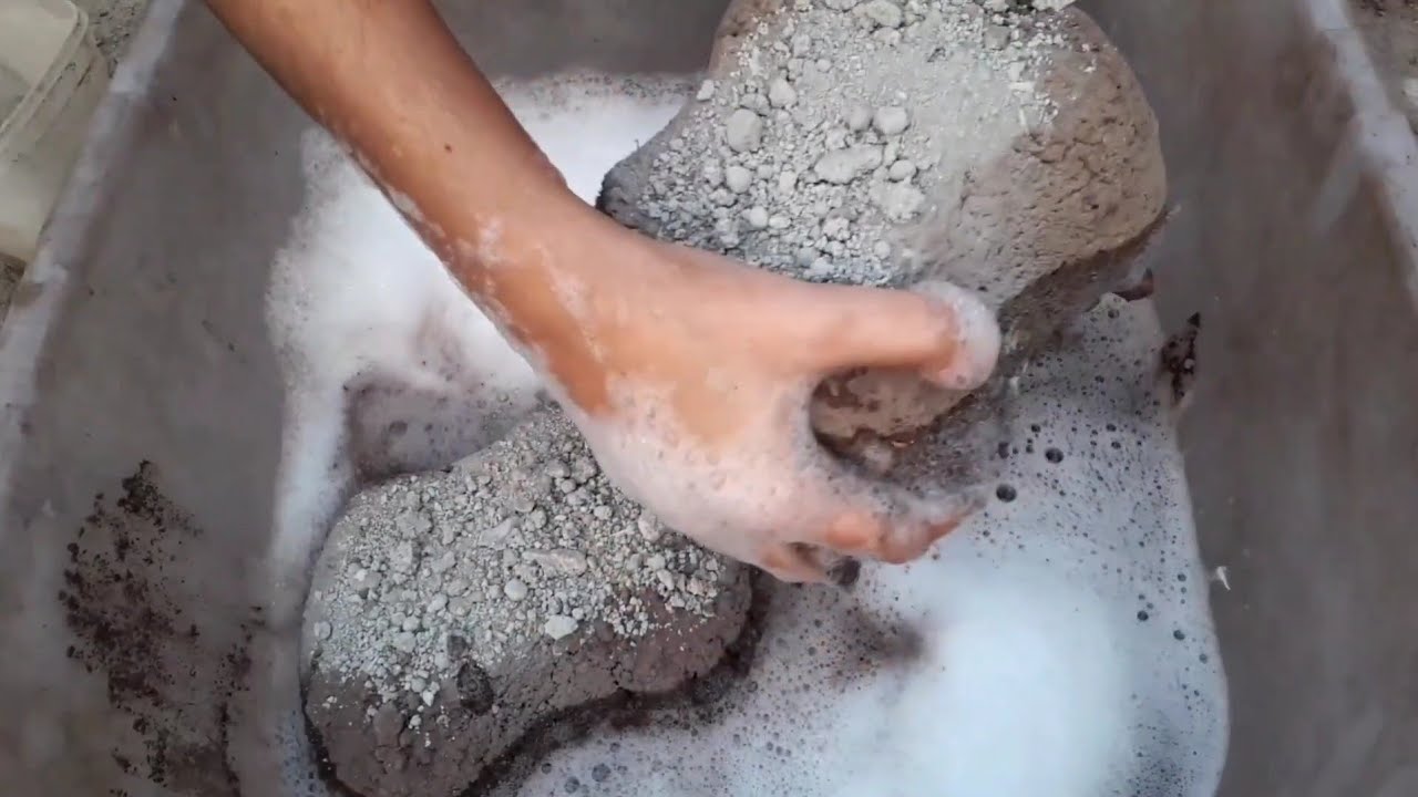 Old brown dirt coated with cement crumbling in foamy water ASMR crumbling video 🤤💤😴
