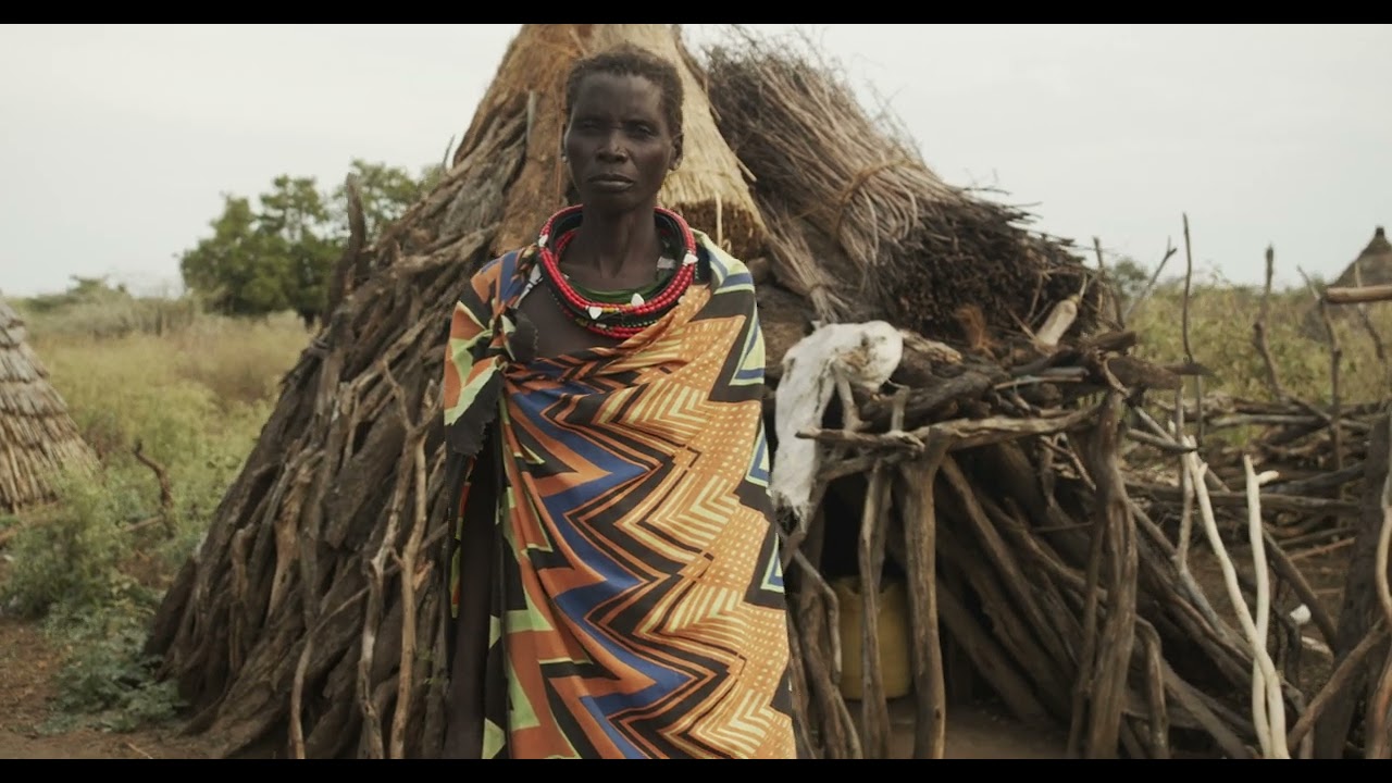 Toposa tribe woman in traditional clothing in a village, Namorunyang State, Kapoeta, South Sudan