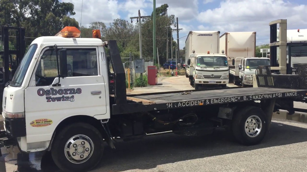 GA1200 -  1988 Nissan SGH400XHFA Tilt Tray Truck