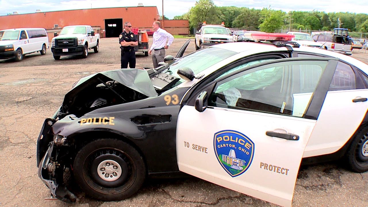 Canton police cruisers collide, crash into home