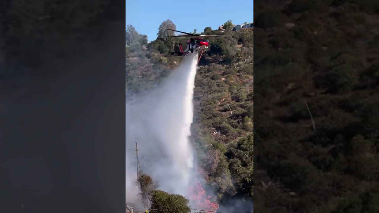 Helicopter helping by dropping water.  #wildfire #aviation #helicopter