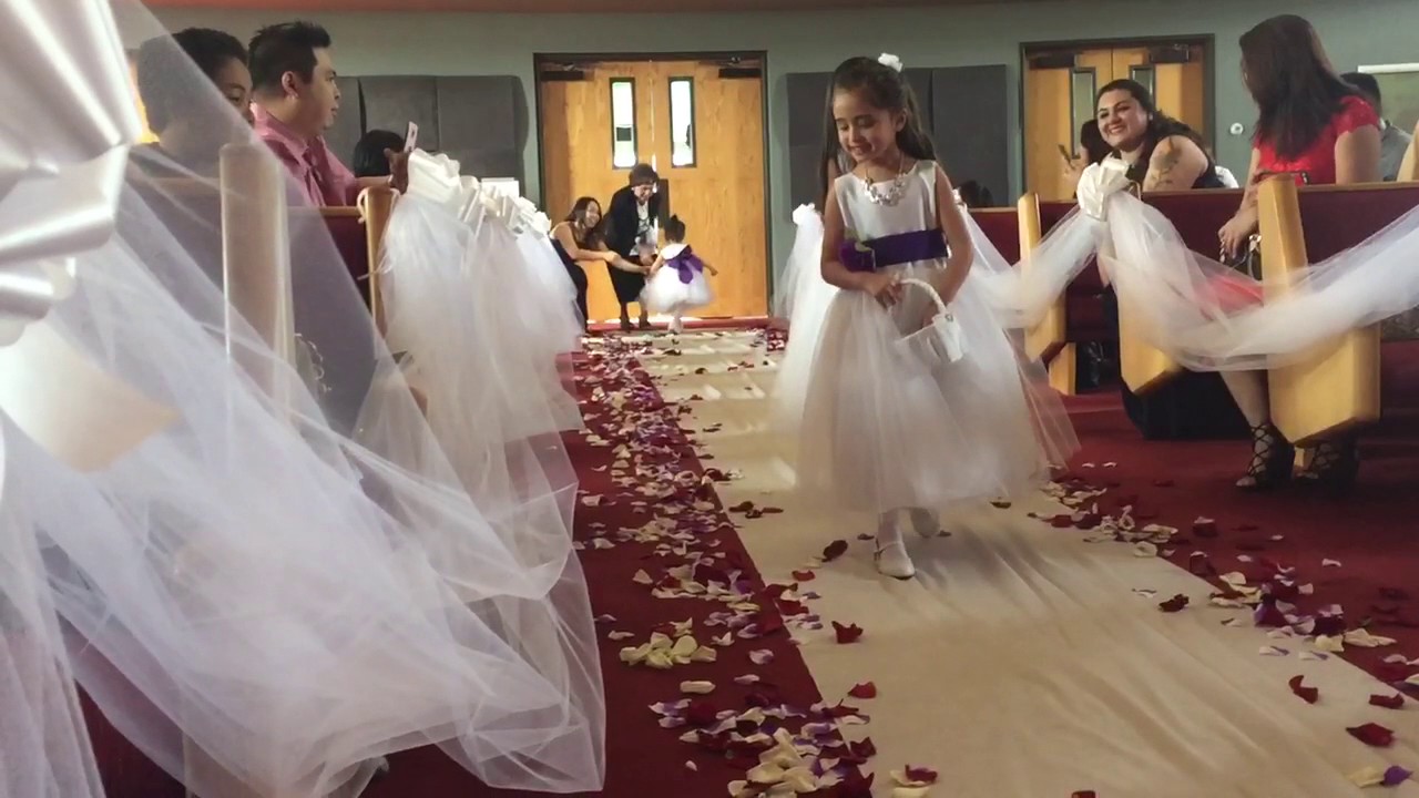 2 yr old flower girl Franzelle walking down the aisle