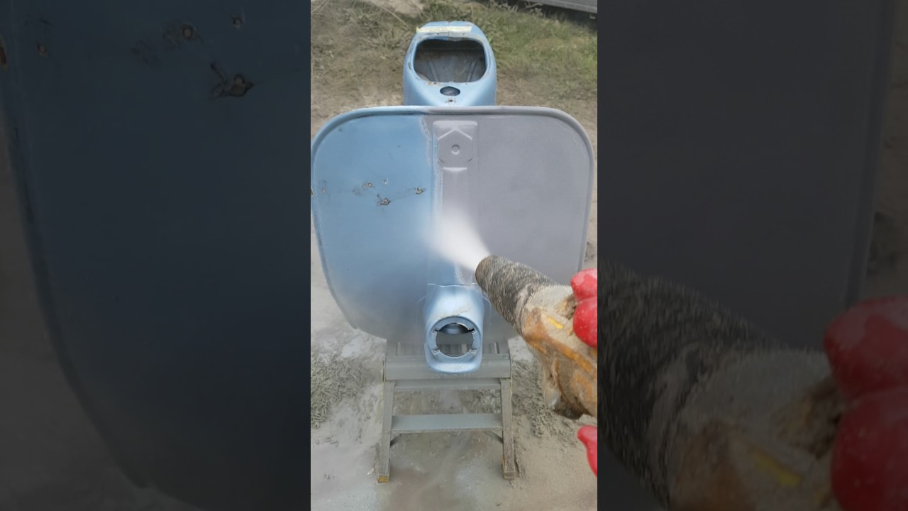 Dustless Blasting a Vespa scooter back to bare metal .