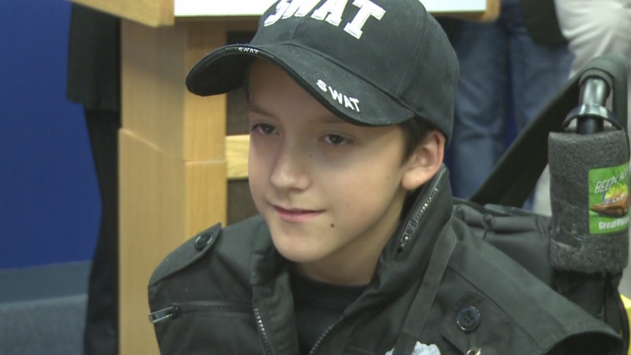 Sick child sworn in as APD SWAT Officer