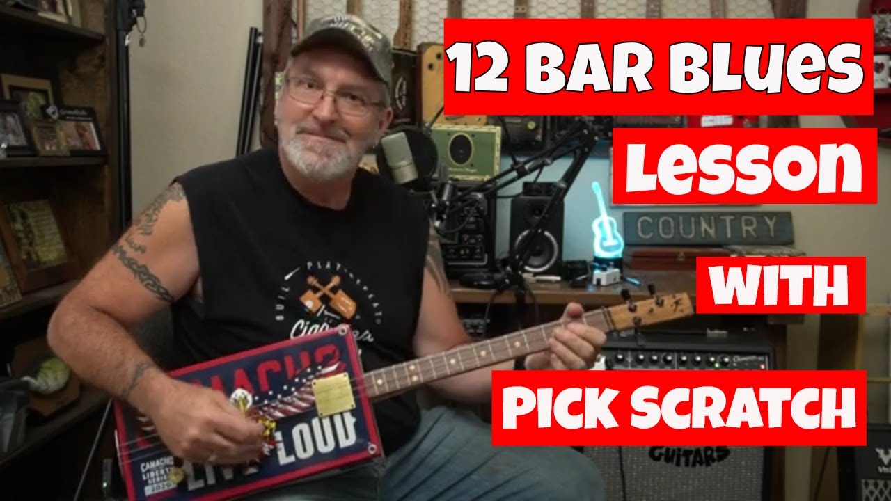 How to Play Cigar Box Guitar - 12 Bar Blues Lesson with Pick Scratch.