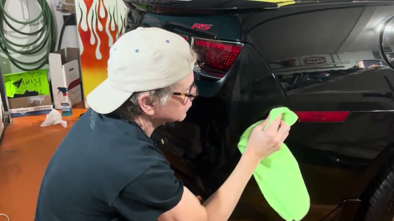 Applying Butter Wax to the right side of the rear bumper 