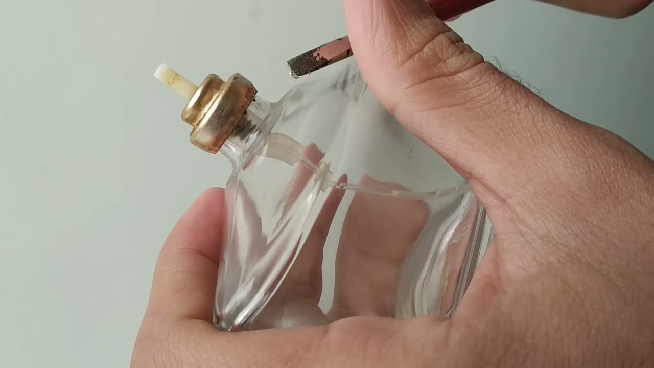 How to Remove/open a perfume bottle cap/top using a flat screwdriver.
