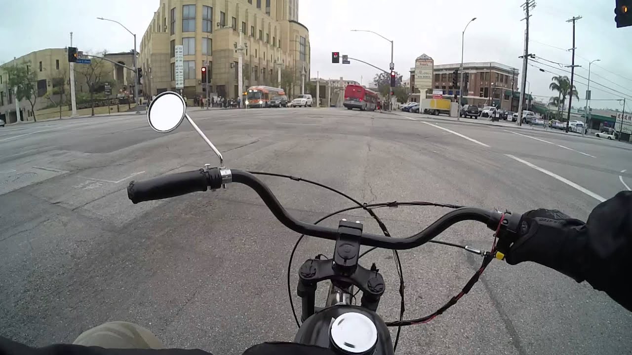 Motorized Bike Lane Spliting through traffic In Downtown LA.