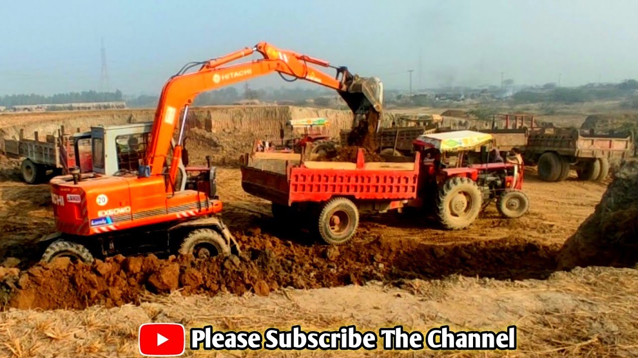 Hitachi 60WD Hydraulic Excavator Loading Overburden On 4 Axle Tractor - Interkat SA