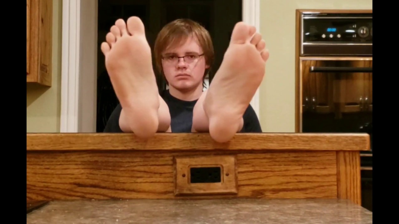 Dusty feet on kitchen counter