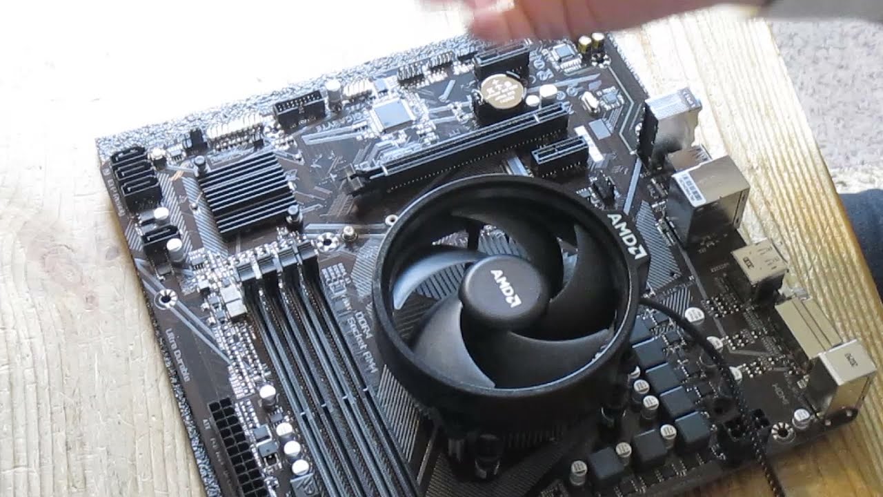 AMD CPU cooler installation. How to install AMD AM4 processor and AMD Wraith cooler on motherboard.