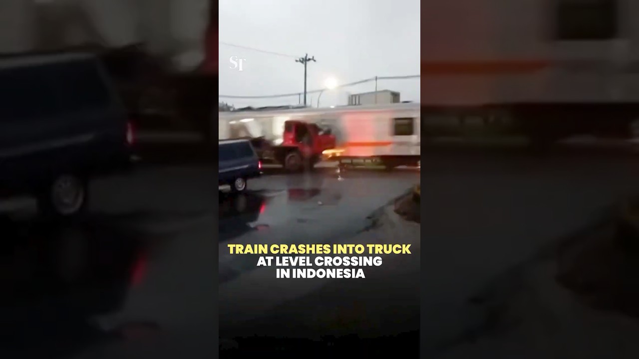 Train crashes into truck at level crossing in Indonesia