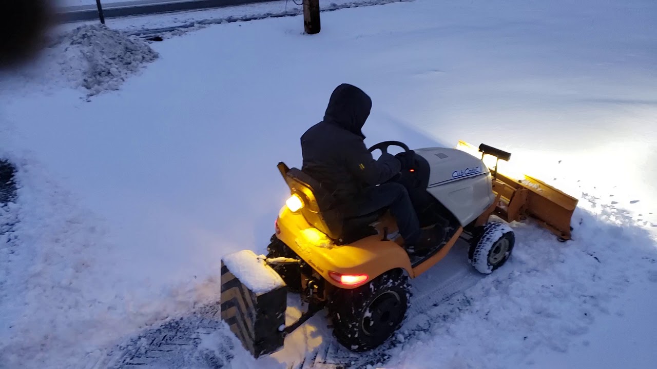 Garden tractor plowing snow Cub cadet 3000 series