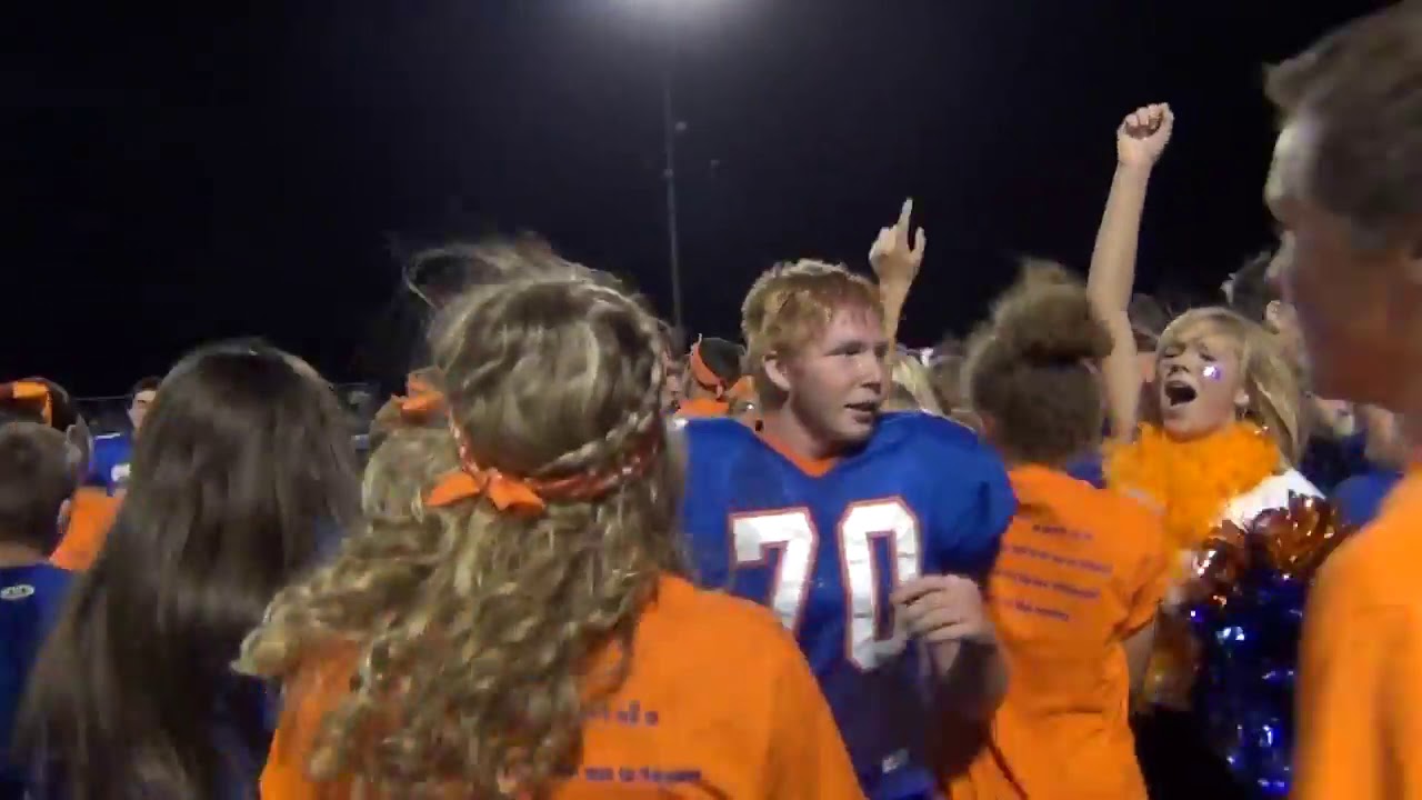 Fans Rush Field at High School Homecoming
