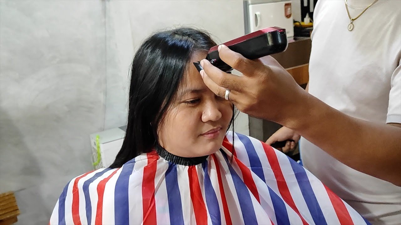 Beautiful model gets an army haircut at barbershop