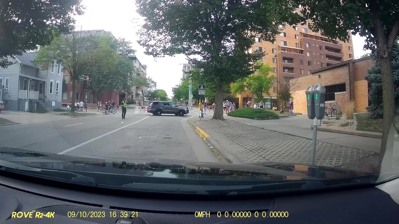 Dash cam footage shows driver ignoring barricades, nearly hitting people