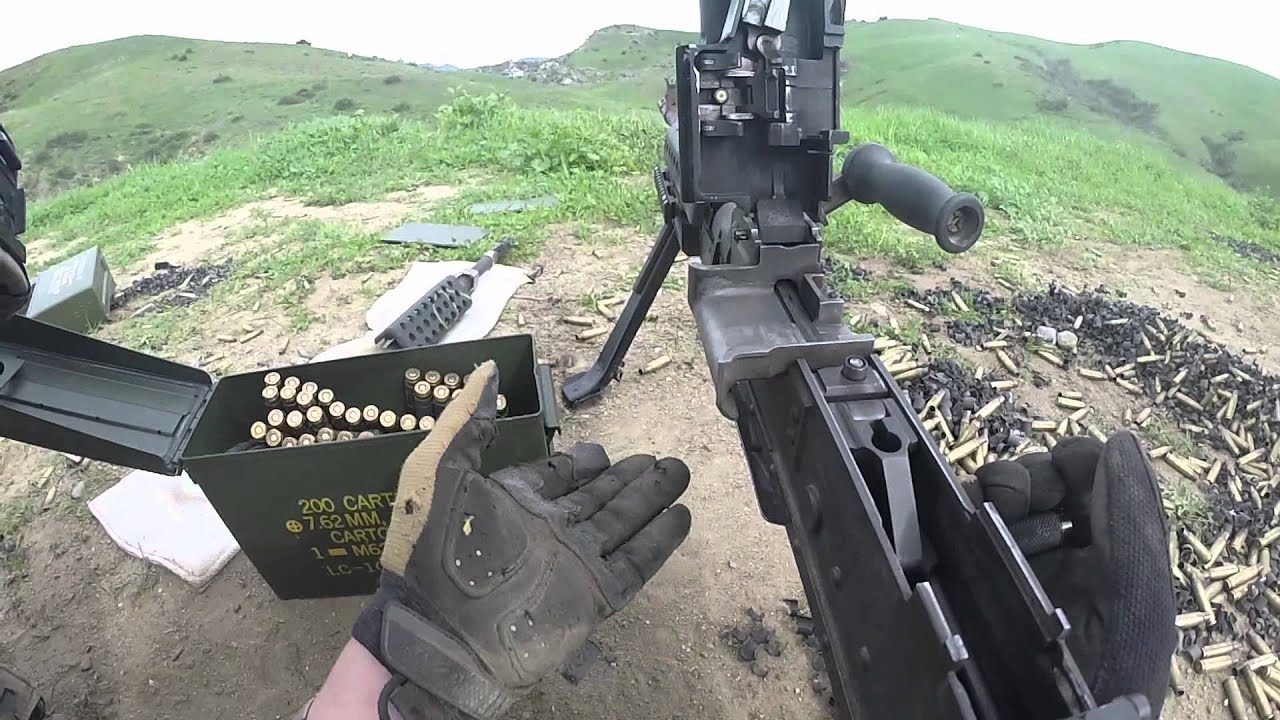 Marines firing a pair of M240B machine guns
