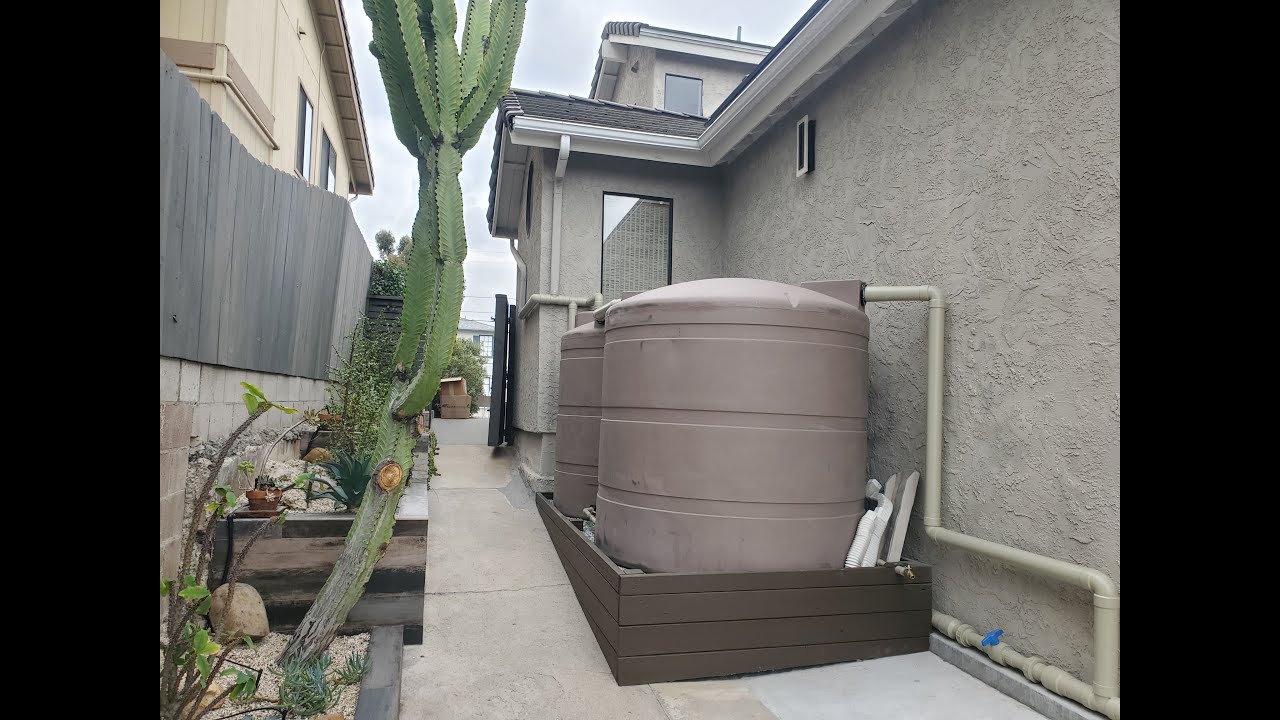 Rainwater harvesting system in San Diego with tanks, overflow and gravity drip irrigation