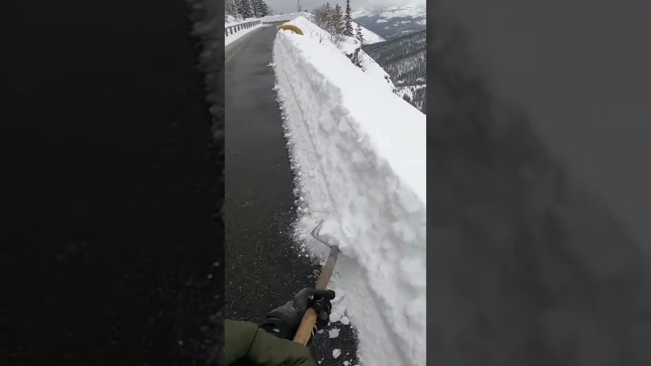 clearing snow on mountain road