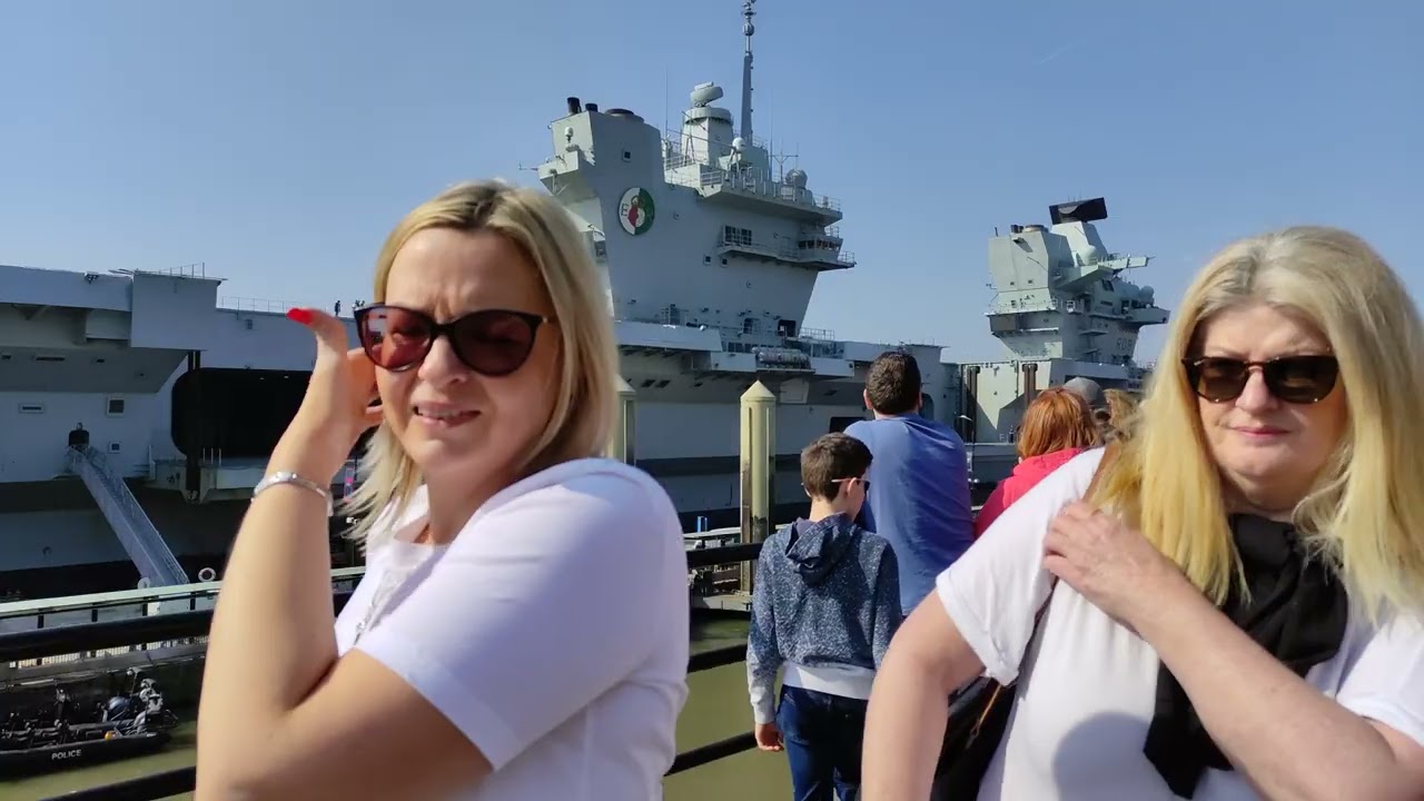 4K The Aircraft Carrier HMS Queen Elizabeth near the Pier Head and Titanic Memorial. 26th March 2022