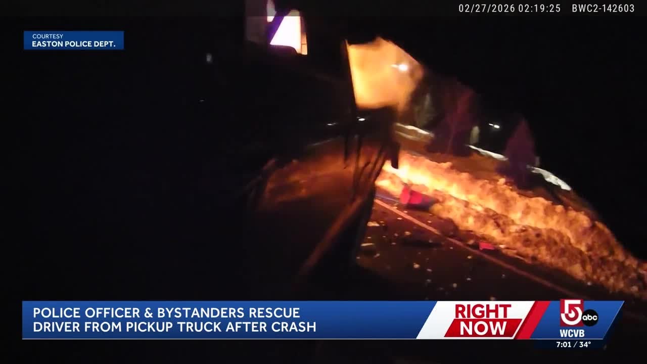 Video shows Mass. police officer, bystanders pull driver from fiery crash