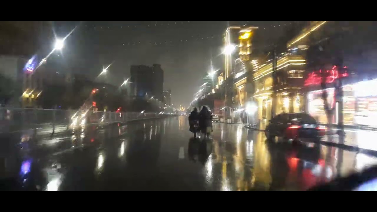 HEAVY RAIN DRIVE .MASHHAD AT NIGHT .ZED SQUARE TO  IMAM REZA SHRINE .