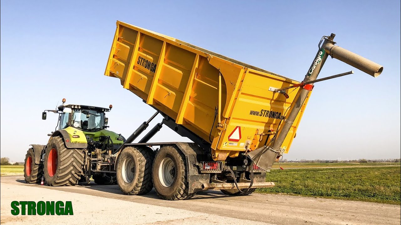 Stronga grūdų puspriekabė Vokietijoje, dirbant kartu su John Deere & Claas