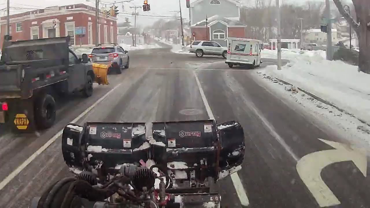 Loader Plowing Snow Around Town for 1