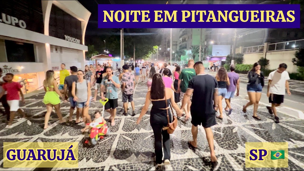 Sexta no calçadão da Praia de Pitangueiras (Guarujá, SP), shopping e feira de artesanato.