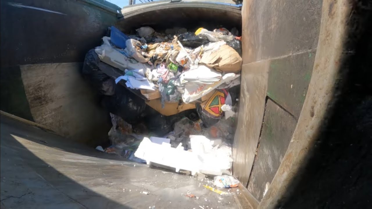 Waste Management front load garbage truck hopper view