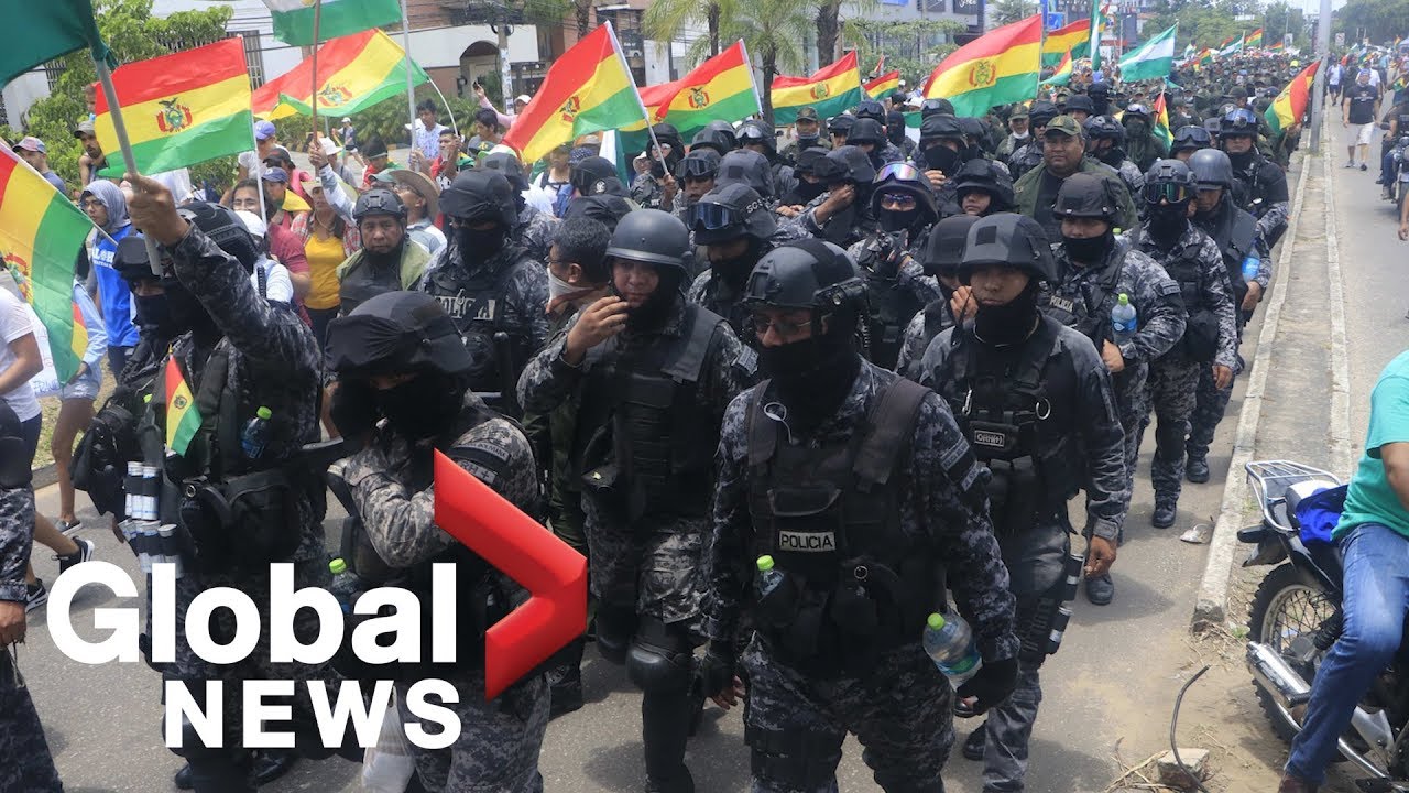 Police join protesters as Bolivia's president calls it 'coup attempt'