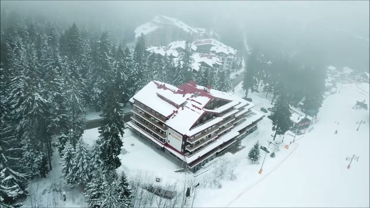Bulgaria:  Borovets Resort: Rila Mountains.  Misty morning in the resort, and some night skiing