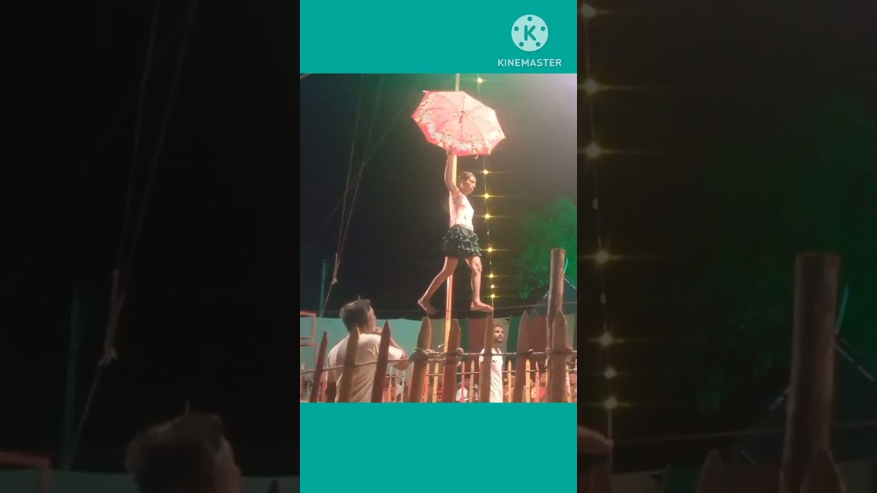 circus girl walk on rope with umbrella