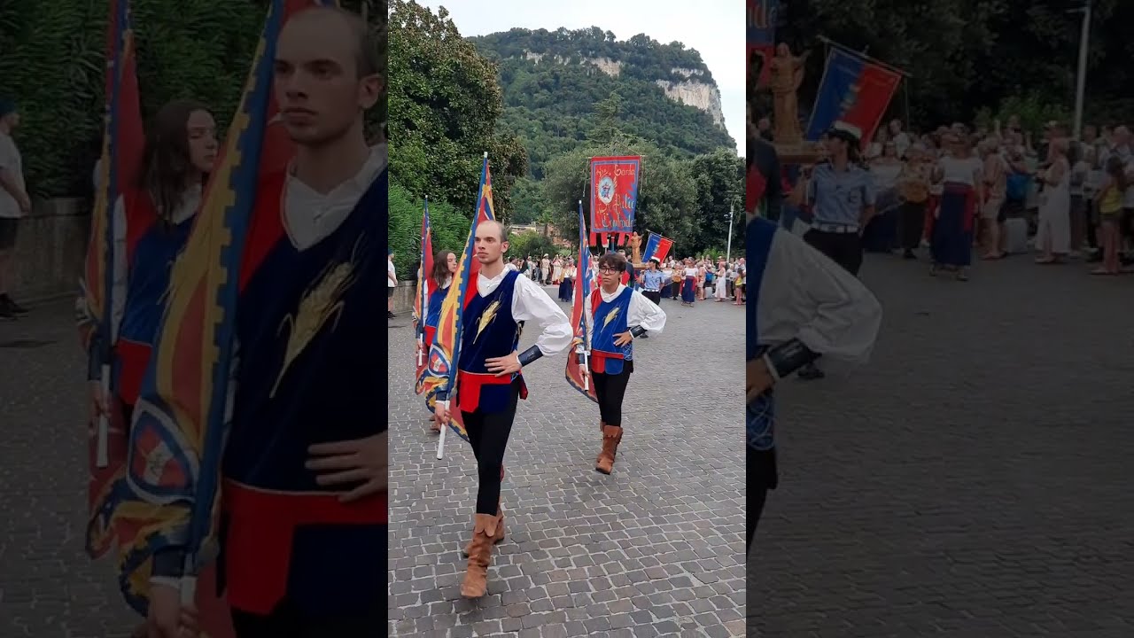 Parade of flag bearers and rowers for the Palio delle Contrade - Garda, Lake Garda, Italy