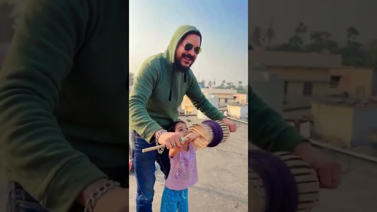 beti k sath patang uda rhe. 