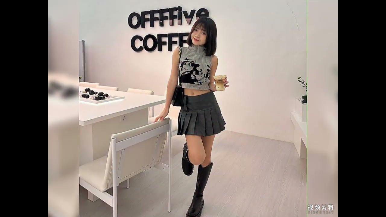 Amiable Asian babe dressing trendy knee high boots with delightful outfit