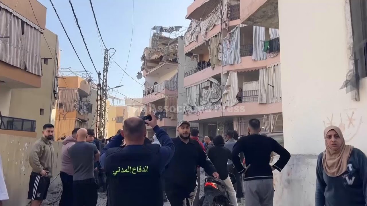 Workers search rubble of damaged buildings after at least 8 people killed in Israeli strike in Sidon