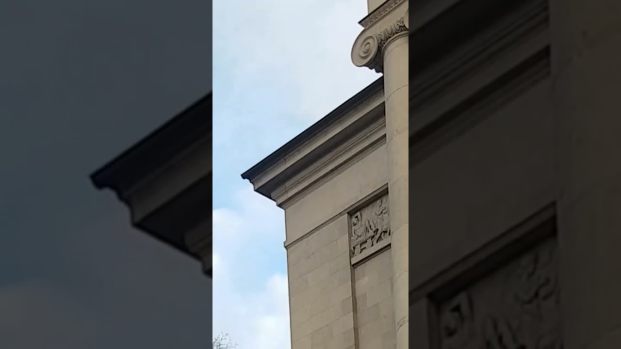A walking tour of the city of Poznan. Antique sculptures at the entrance to the opera house.