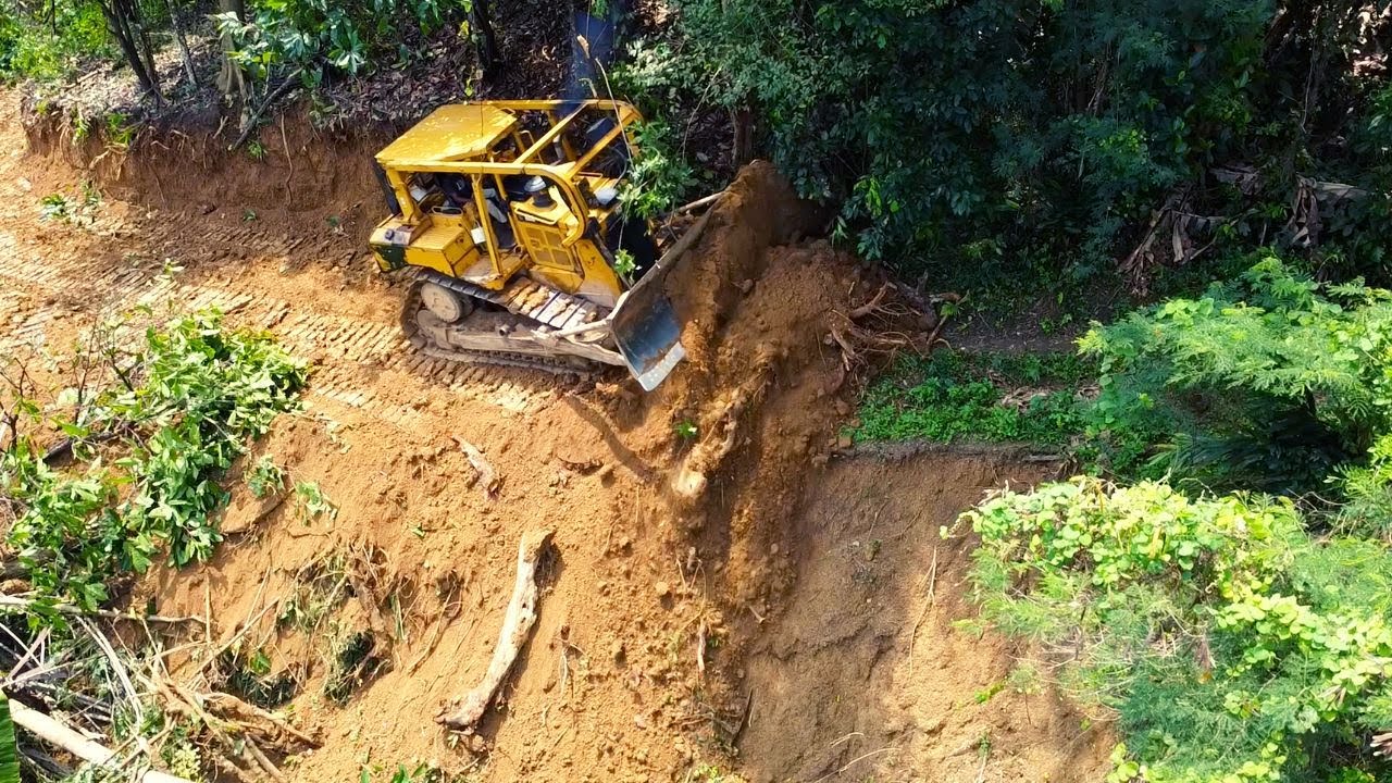 The Skilled  Operator CAT D6R XL Dozer Leveling Mountain Road