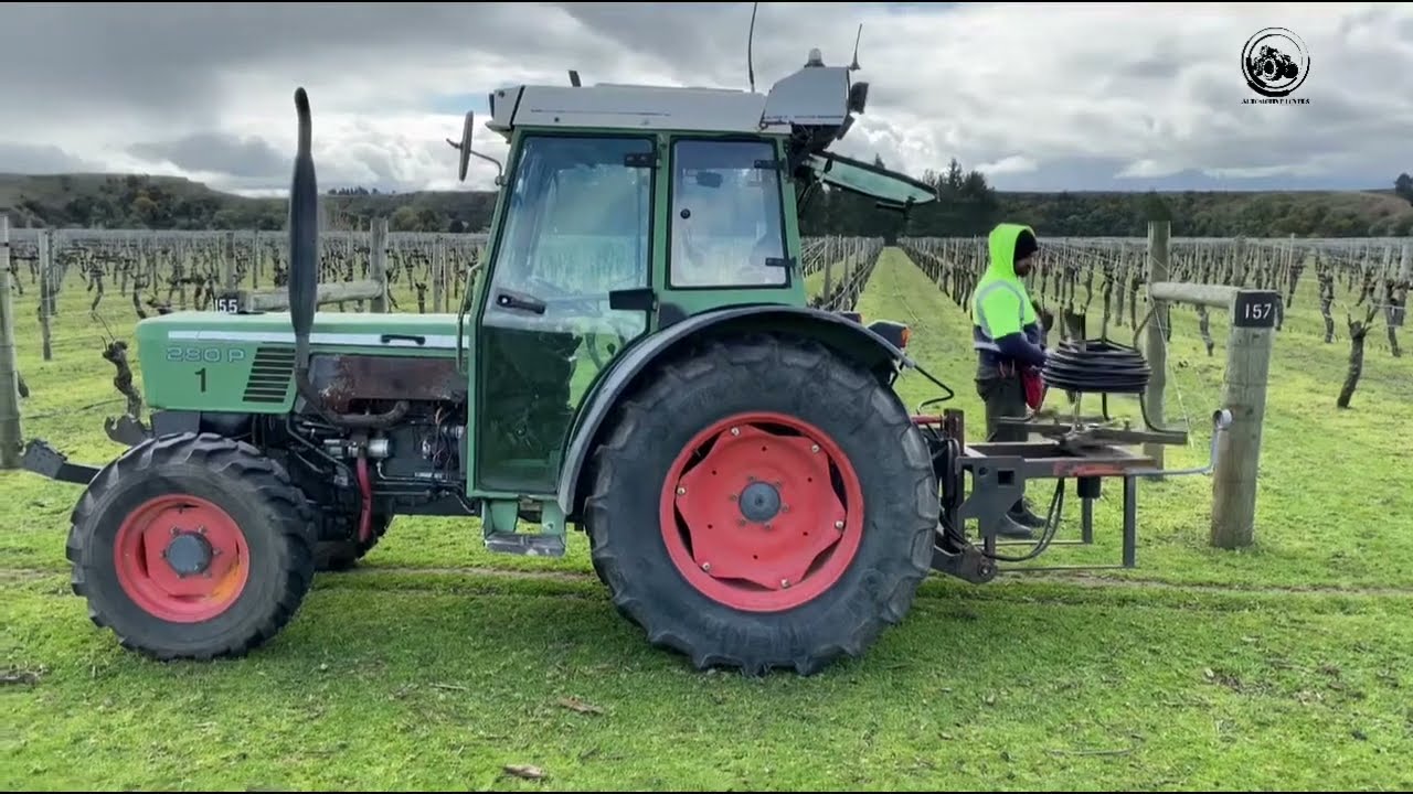 fendt tractor on field rolling pipe nz