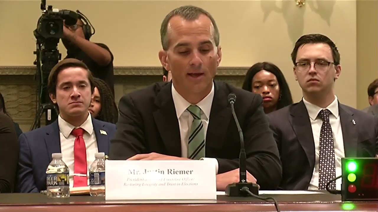 Mr. Justin Riemer delivers opening remarks at voter list maintenance hearing